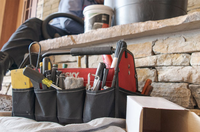 Original Photo- Tools- Mountain Man Fireplace & Chimney tools in front of fireplace